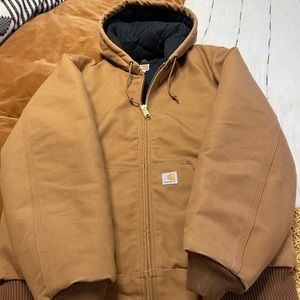 Mens Carhartt hooded jacket size medium tall. Never worn, no blemishes.